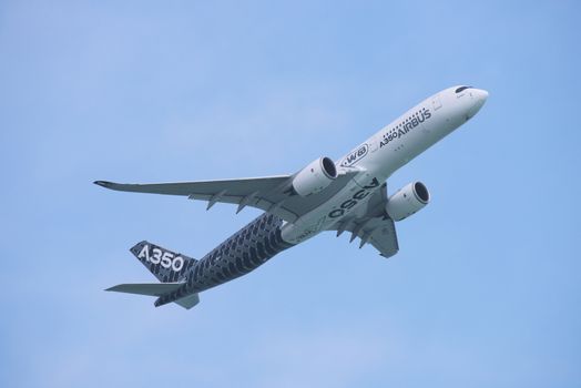 Singapore - February 14, 2016: Airbus A350 XWB during it’s performance at Singapore Airshow at Changi Exhibition Centre in Singapore.