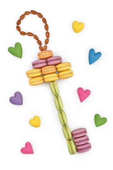Macarons sweet colorful, key shape. Love, handmade hearts. French traditional delicious dessert, almond. Unusual creative romantic still life. Concept for love story. Valentines Day. Isolated