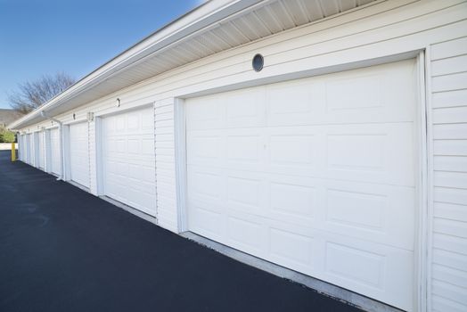 Row of garage doors at an apartment complex.