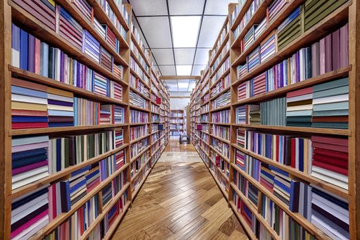 Looking down the aisle of a used bookstore.