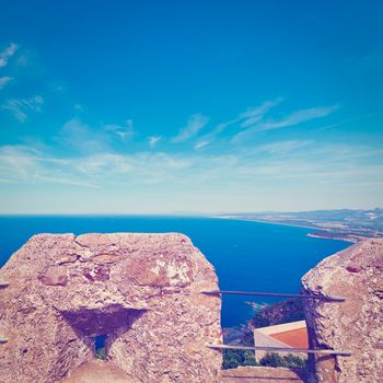 Views of the Mediterranean Sea through the Battlements of a Medieval Fortress in Italy, Instagram Effect