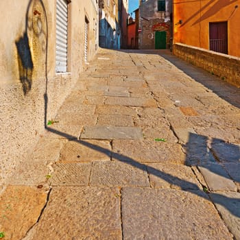 Narrow Street with Old Buildings in Italian City of Prato