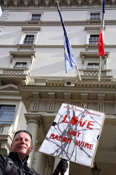 UK, London: A protester holds a sign reading, Love, not razor wire, during a Valentine's Day rally outside the French Embassy in London, supporting the refugees at the infamous Jungle camp in Calais, France on February 14, 2016.