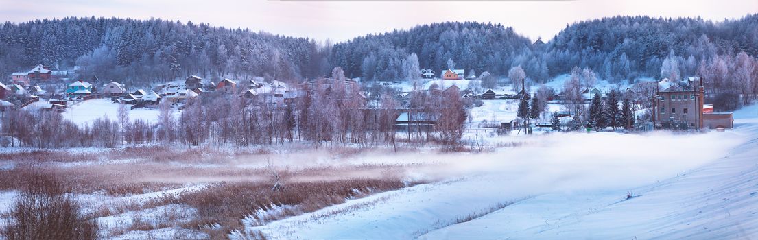 Winter town. January evening. Winter fog in Belarus