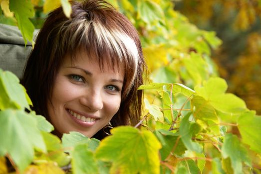 Beautiful girl's portrait with soft autumn background