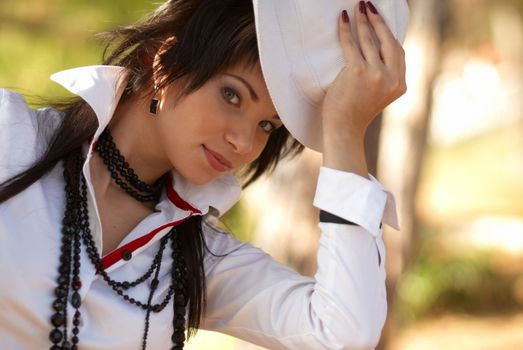 Beautiful girl in the white hat- soft background portrait