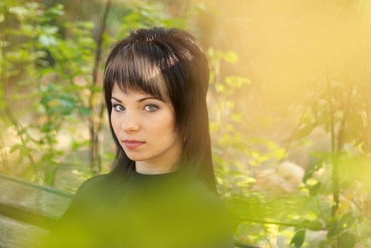 Beautiful girl's portrait with soft autumn background