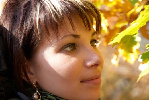 Beautiful girl's portrait with soft autumn background