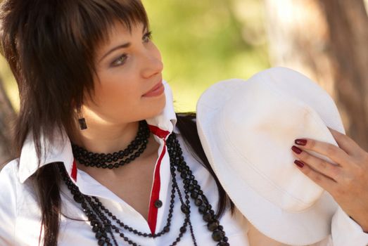 Beautiful girl in the white hat- soft background portrait