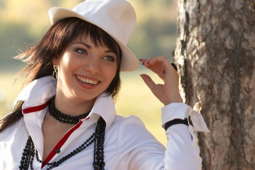 Beautiful girl in the white hat- soft background portrait