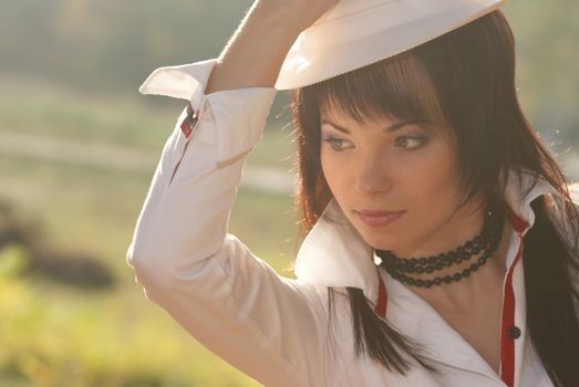 Beautiful girl in the white hat- soft background portrait