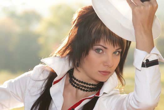 Beautiful girl in the white hat- soft background portrait