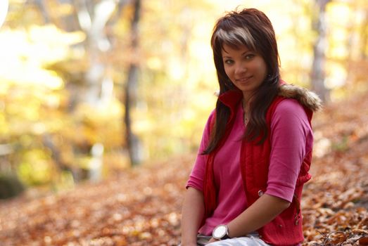 Beautiful girl's portrait in the autumn park