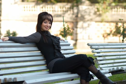 Portrait of beautiful girl sitting on the bench