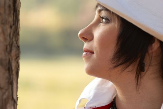 Beautiful girl in the white hat- soft background portrait