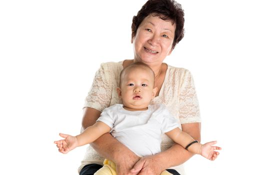 Portrait of Asian grandmother and grandson. Isolated on white background.