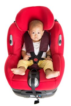 Asian baby boy sitting in car seat, isolated on white background.