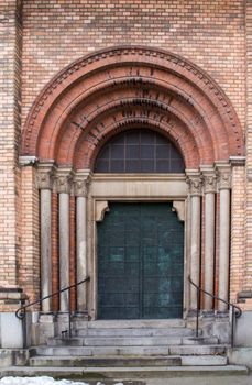 Saint Anton Church with its bricks facade. Entrance to the church.