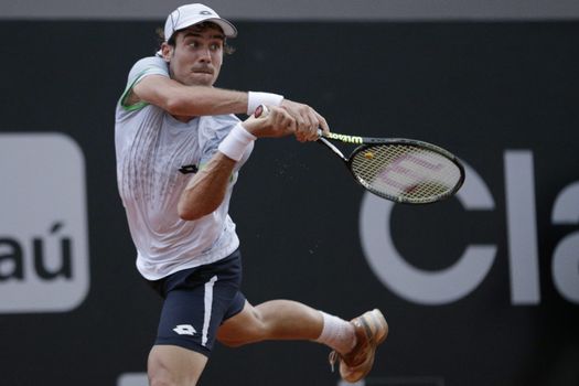 BRAZIL, Rio de Janeiro:  Guido Pella of Argentina returns the ball to John Isner of USA during a match of 2016 Rio Open tennis tournament at Jockey Club Brasileiro in Rio de Janeiro, on February 15, 2016. 