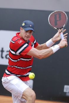 BRAZIL, Rio de Janeiro: John Isner of USA returns the ball to Guido Pella of Argentina during a match of 2016 Rio Open tennis tournament at Jockey Club Brasileiro in Rio de Janeiro, on February 15, 2016. 