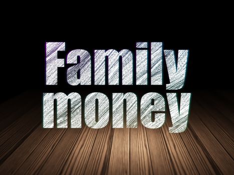 Money concept: Glowing text Family Money in grunge dark room with Wooden Floor, black background