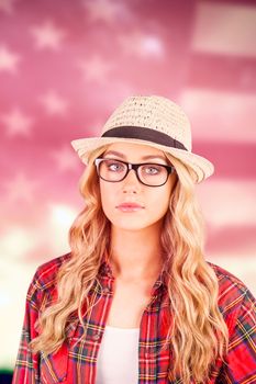 Gorgeous blonde hipster posing  against composite image of united states of america flag