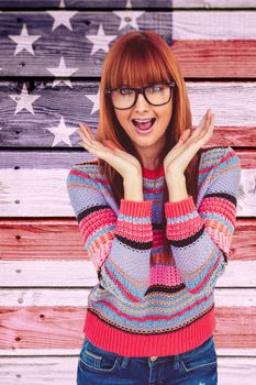 Astonished hipster woman looking at camera against composite image of usa national flag