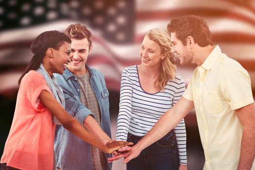 Happy creative team giving a motivational gesture against composite image of digitally generated united states national flag