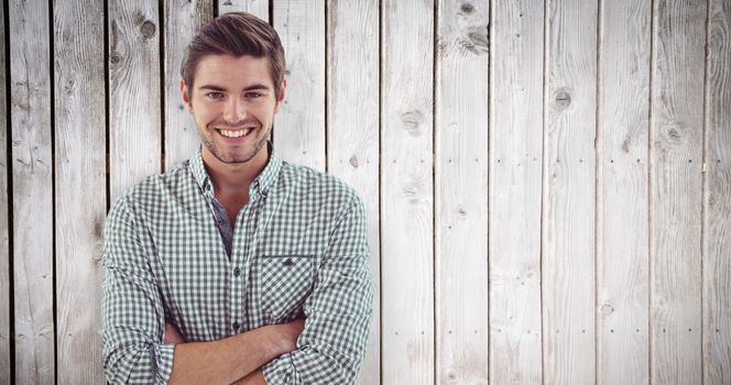 Smiling crestive business man against wooden planks