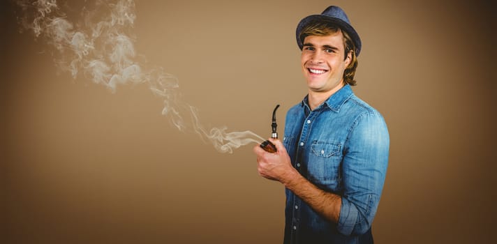 Cheerful hipster holding pipe against grey background with vignette