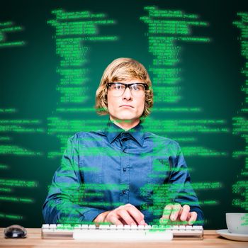 Focused hipster businessman using computer against green background with vignette