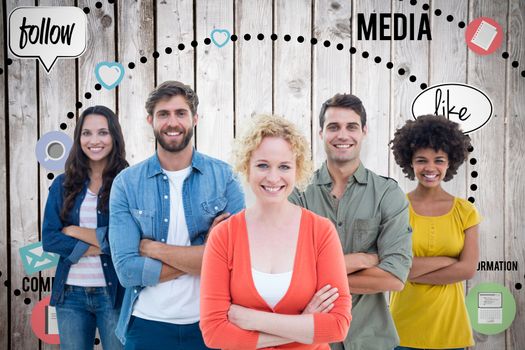 Group portrait of happy young colleagues against wooden planks