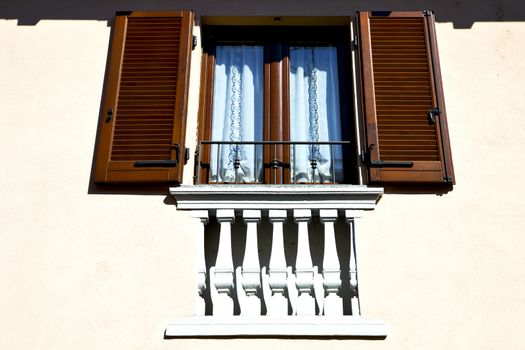 shutter europe  italy  lombardy        in  the milano old   window closed brick      abstract grate  