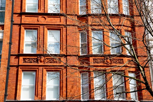 in europe london old red brick wall and          historical window