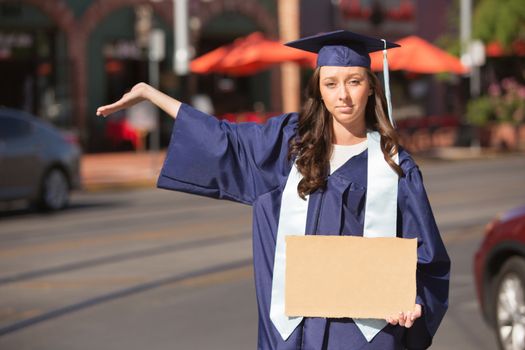 Serious female student holding hand out with cardboard sign