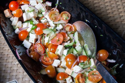 salad with fresh tomatoes cherry cheese and lettuce