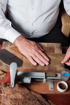 Old man Torcedor rolling hand made cigars parejos