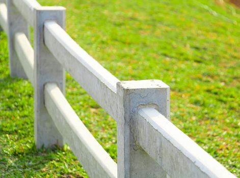 white concrete fence in country farm land