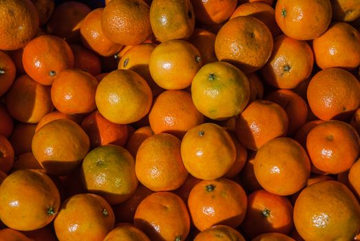 Bunch of fresh mandarin oranges on market