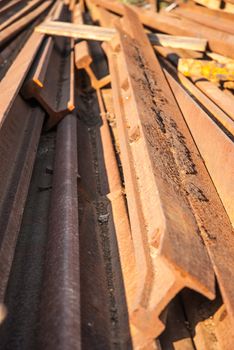 Stack of railway tracks. Old rusted rails