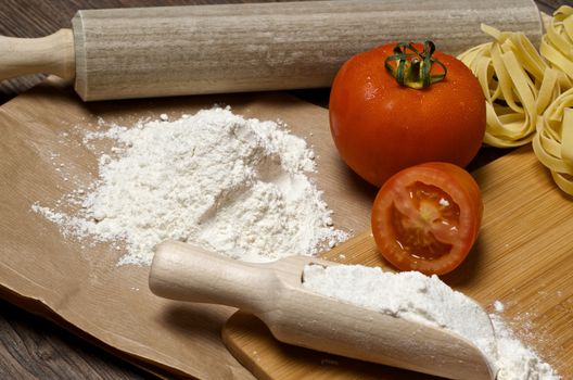 Still life with raw homemade pasta and ingredients for pasta