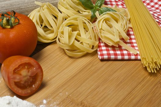 Still life with raw homemade pasta and ingredients for pasta