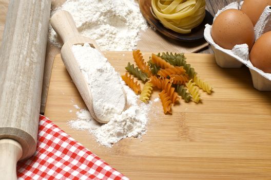 Still life with raw homemade pasta and ingredients for pasta