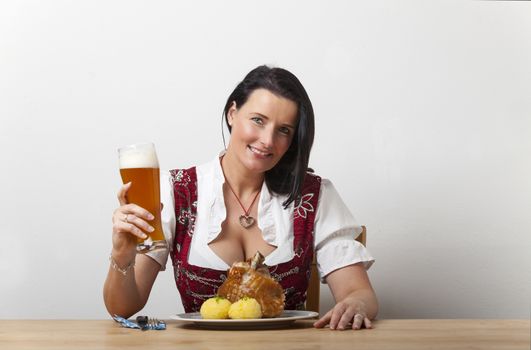 bavarian woman with roasted knuckle of pork