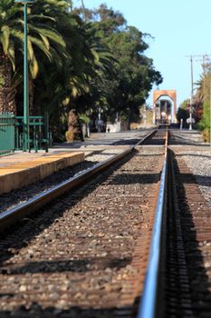 Train Station in Ventura California with a view of the tracks and train.
