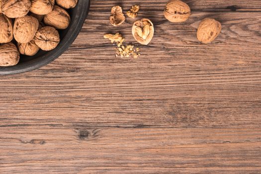 Nuts set background with copyspace on a wood background. Top view with copy space