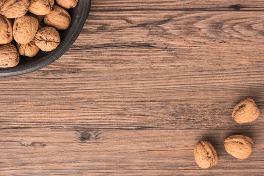 Nuts set background with copyspace on a wood background. Top view with copy space