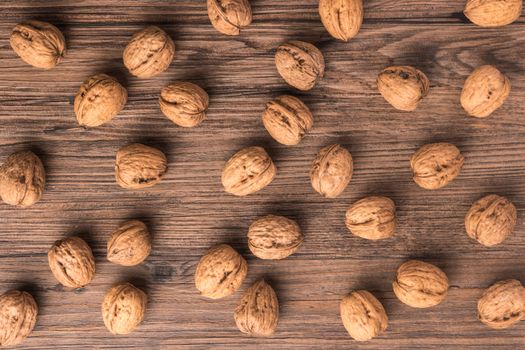 Nuts set background with copyspace on a wood background. Top view with copy space