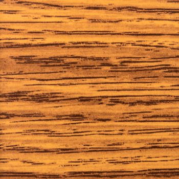 Abstract wood texture with focus on the wood's grain. Mahogany wood