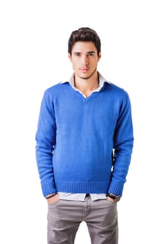 Smiling cool young man with wool sweater on white background looking at camera